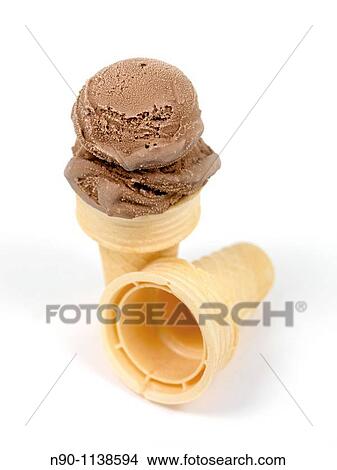 Chocolate icecream in an icecream cone isolated against a white background View Large Photo Image Picture - Chocolate icecream in an icecream cone isolated against a white background. Fotosearch