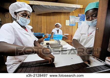 Chocolate making in the laboratory of Claudio Corallo, agronomist, cocoa producer and chocolate maker, city of Sao Tome, Sao Tome Island, Republic of Sao Tome and Principe, Africa. View Large Photo Image Stock Photo - Chocolate making in the laboratory of Claudio Corallo, agronomist, cocoa producer and chocolate maker, city of Sao Tome, Sao Tome Island, Republic of Sao Tome and Principe, Africa.. Fotosearch