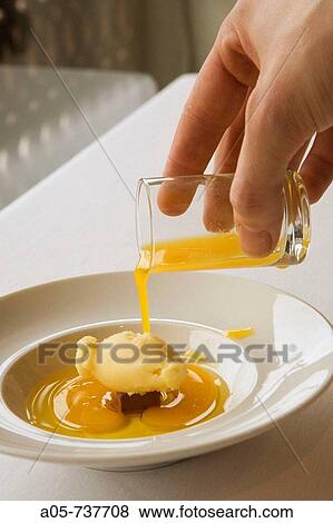 Chocolate portion with pineapple ice cream, oil base and orange juice at Casa Gerardo restaurant, Prendes. Asturias, Spain View Large Photo Image Stock Photo - Chocolate portion with pineapple ice cream, oil base and orange juice at Casa Gerardo restaurant, Prendes. Asturias, Spain. Fotosearch