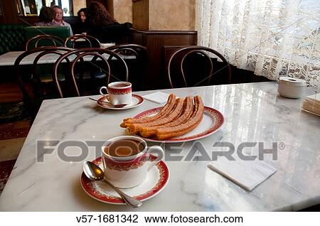 Chocolate with porras for two. Madrid, Spain. View Large Photo Image Stock Image - Chocolate with porras for two. Madrid, Spain.. Fotosearch