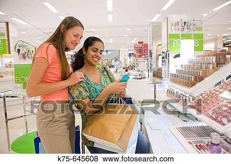 Stock Photo - Choosing cosmetics.. Fotosearch