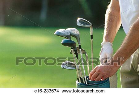 Choosing golf clubs View Large Photo Image Picture - Choosing golf clubs. Fotosearch