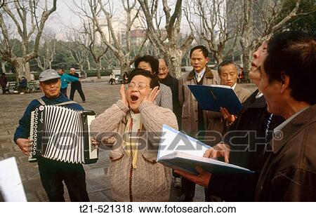 Stock Photo - Christian Chinese sing Western songs in a park in Shanghai. China.. Fotosearch