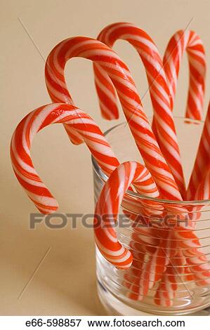 Stock Photo - Christmas candy canes in clear glass. Fotosearch