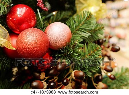 Stock Photo - Christmas decoration Red baubles on tree. Fotosearch