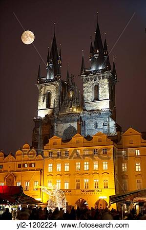 Picture - Christmas Market In Prague's Old Town Square with Church Of Out Lady Before Tyn at night. Fotosearch