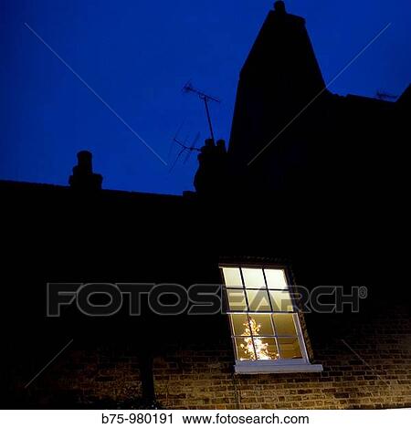Christmas tree behind window View Large Photo Image Stock Image - Christmas tree behind window. Fotosearch