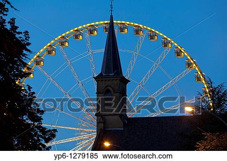 Stock Photography - church and Ferris wheel at night, Luxembourg. Fotosearch