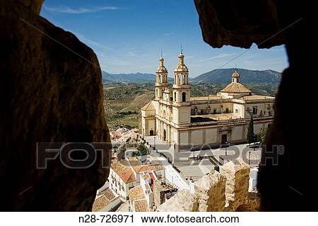 Church of Nuestra Seora de la Encarnacion as seen through the Arab castle walls, Olvera. Pueblos Blancos (? white towns? ), Cadiz province, Andalucia, Spain View Large Photo Image Stock Image - Church of Nuestra Seora de la Encarnacion as seen through the Arab castle walls, Olvera. Pueblos Blancos (? white towns? ), Cadiz province, Andalucia, Spain. Fotosearch