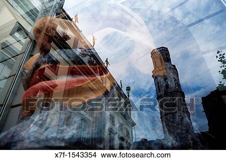 Picture - Church of Sant Pere Reflected in a Shop window of Dal??s Theatre Museum, that houses a sculpture, Figueres. Girona province. Catalonia. Spain. Fotosearch