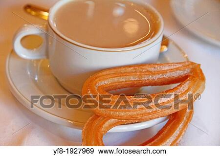 Stock Photo - Churros fried crullers spanish flour fritters and coffee. Fotosearch