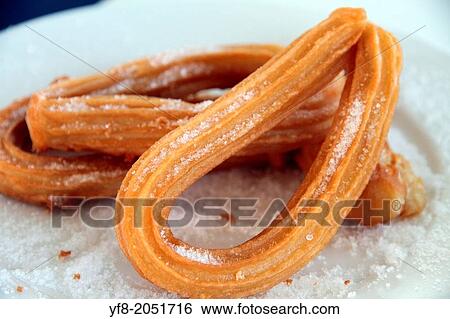 Churros with sugar on plate. View Large Photo Image Stock Photograph - Churros with sugar on plate.. Fotosearch