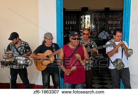 Stock Photo - Cienfuegos Cuba city center with band playing in bar. Fotosearch