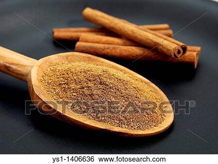 CINNAMON BARK AND POWDER cinnamomum zeylanicum AGAINST BLACK BACKGROUND View Large Photo Image Stock Photograph - CINNAMON BARK AND POWDER cinnamomum zeylanicum AGAINST BLACK BACKGROUND. Fotosearch