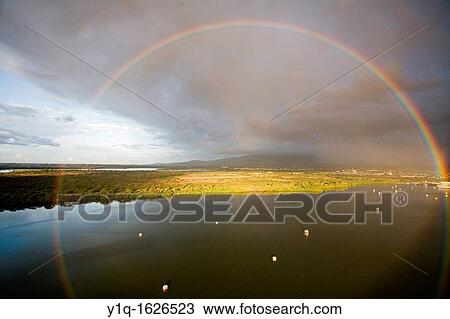 Circular rainbow from helicopter, Pearl Harbor, Oahu, Hawaii View Large Photo Image Stock Image - Circular rainbow from helicopter, Pearl Harbor, Oahu, Hawaii. Fotosearch