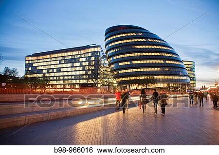 City Hall is the headquarters of the Greater London Authority Designed by Norman Foster, it opened in July 2002 The building has an unusual bulbous shape, intended to reduce its surface area and thus improve energy efficiency View Large Photo Image Stock Photograph - City Hall is the headquarters of the Greater London Authority Designed by Norman Foster, it opened in July 2002 The building has an unusual bulbous shape, intended to reduce its surface area and thus improve energy efficiency. Fotosearch