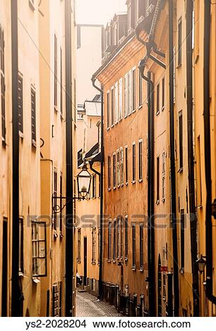 City scene with old buildings in narrow alley in Stockholm, capital of Sweden. View Large Photo Image Picture - City scene with old buildings in narrow alley in Stockholm, capital of Sweden.. Fotosearch