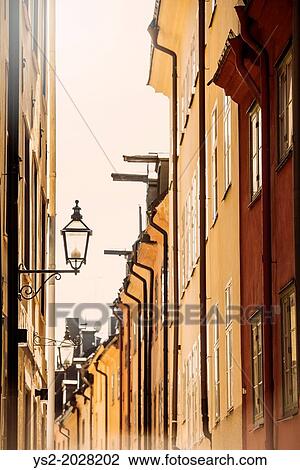 City scene with old buildings in narrow alley in Stockholm, capital of Sweden. View Large Photo Image Stock Image - City scene with old buildings in narrow alley in Stockholm, capital of Sweden.. Fotosearch
