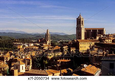 city skyline, in background at right Catedral and at left Colegiata de Sant Feliu, Girona, Catalonia, Spain. View Large Photo Image Picture - city skyline, in background at right Catedral and at left Colegiata de Sant Feliu, Girona, Catalonia, Spain.. Fotosearch