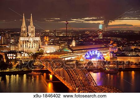 City view of Cologne at night with Cologne Cathedral, Rhine River, Musical Dome and Hohenzollern Bridge, Cologne, North Rhine-Westphalia, Germany, Europe View Large Photo Image Stock Image - City view of Cologne at night with Cologne Cathedral, Rhine River, Musical Dome and Hohenzollern Bridge, Cologne, North Rhine-Westphalia, Germany, Europe. Fotosearch