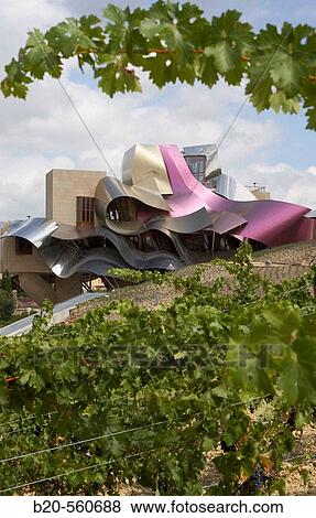 Ciudad del Vino, Herederos de Marques de Riscal winery building by Frank O. Gehry. Elciego, Rioja alavesa. Alava, Euskadi, Spain View Large Photo Image Stock Photo - Ciudad del Vino, Herederos de Marques de Riscal winery building by Frank O. Gehry. Elciego, Rioja alavesa. Alava, Euskadi, Spain. Fotosearch