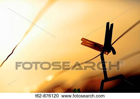 Stock Image - Clamps clothing Late spring Housework. Fotosearch