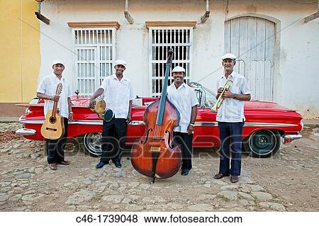 Classic car and music band, Trinidad city, Sancti Spiritus Province, Cuba. View Large Photo Image Stock Photo - Classic car and music band, Trinidad city, Sancti Spiritus Province, Cuba.. Fotosearch
