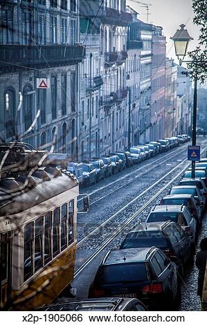 Classic old tram in the streets of Alfama in Lisbon, Portugal View Large Photo Image Stock Photograph - Classic old tram in the streets of Alfama in Lisbon, Portugal. Fotosearch