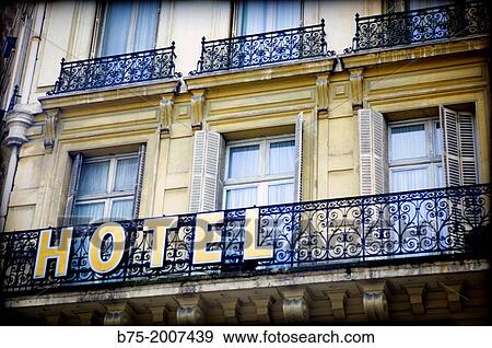 Classical architecture facade with balconies with a sign of hotel in the center of Paris, France, Europe. View Large Photo Image Stock Photo - Classical architecture facade with balconies with a sign of hotel in the center of Paris, France, Europe.. Fotosearch