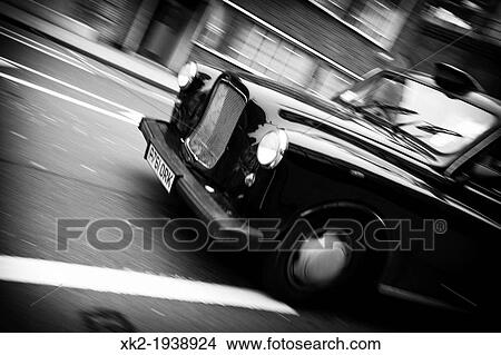 Classical old Black cab, taxi panning, detail of the front, London, UK View Large Photo Image Picture - Classical old Black cab, taxi panning, detail of the front, London, UK. Fotosearch