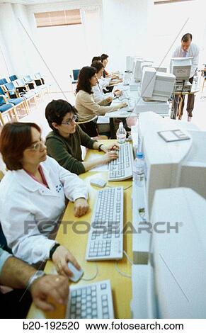 Stock Image - Classroom of computers, training at hospital. Fotosearch