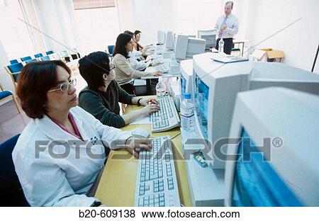 Stock Photo - Classroom of computers, training at hospital. Fotosearch