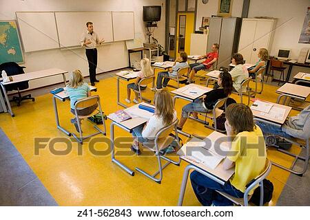 Classroom with students and teacher View Large Photo Image Stock Image - Classroom with students and teacher. Fotosearch