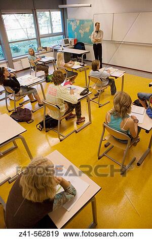 Stock Photo - Classroom with students and teacher. Fotosearch