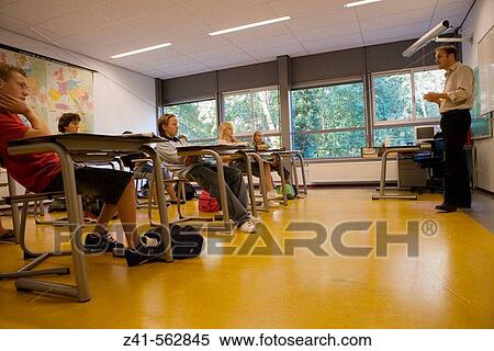 Stock Photography - Classroom with students and teacher. Fotosearch