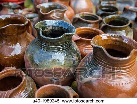 Stock Photography - Clay pots at market. Fotosearch