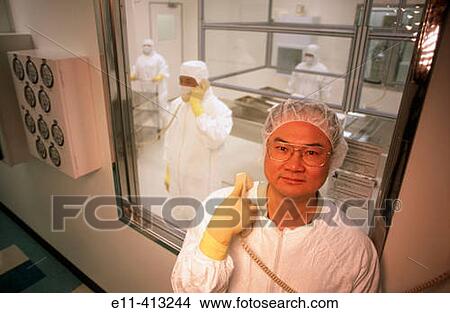 Clean room worker on phone View Large Photo Image Picture - Clean room worker on phone. Fotosearch
