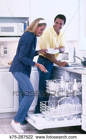 cleaning the dishes together View Large Photo Image Stock Image - cleaning the dishes together. Fotosearch
