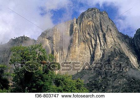 Clearing fall storm clouds over Lost Arrow Spire, Yosemite Valley, Yosemite National Park, CALIFORNIA View Large Photo Image Stock Photo - Clearing fall storm clouds over Lost Arrow Spire, Yosemite Valley, Yosemite National Park, CALIFORNIA. Fotosearch