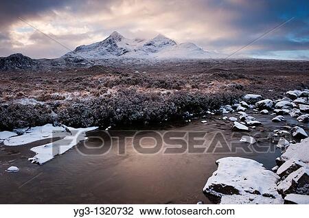 Stock Image - Clearning winter storm over Black Cuillins, Isle of Skye, Scotland. Fotosearch