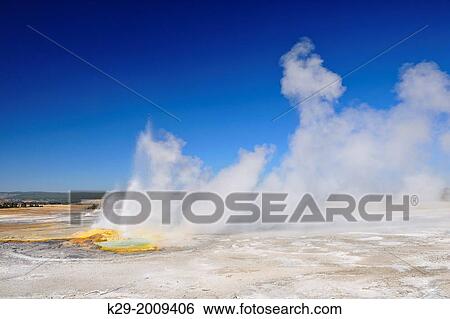 Stock Photograph - Clepsydra Geyser eruption, Fountain Paint Pots Geyser Basin, Yellowstone NP, Wyoming, USA.. Fotosearch
