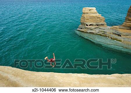 Cliff diving near Sidari village Corfu, Greece View Large Photo Image Stock Photograph - Cliff diving near Sidari village Corfu, Greece. Fotosearch