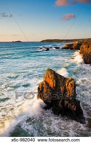 Cliffs at Gwithian Cornwall UK with Godrevy Lighthouse in the distance View Large Photo Image Stock Image - Cliffs at Gwithian Cornwall UK with Godrevy Lighthouse in the distance. Fotosearch
