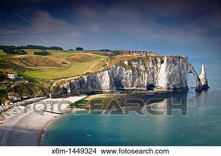 Cliffs, natural arch and stone beach Etretat, Le Havre, Seine-Maritime, Normandy, France, Europe View Large Photo Image Picture - Cliffs, natural arch and stone beach Etretat, Le Havre, Seine-Maritime, Normandy, France, Europe. Fotosearch