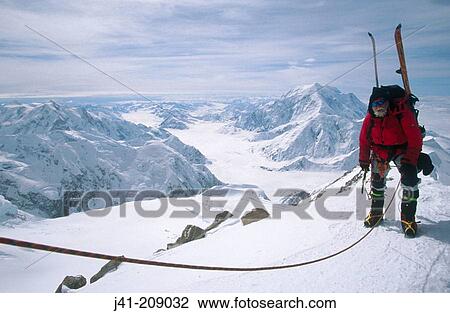 Stock Image - Climber and Mount Foraker. Denali National Park. Alaska. USA. Fotosearch
