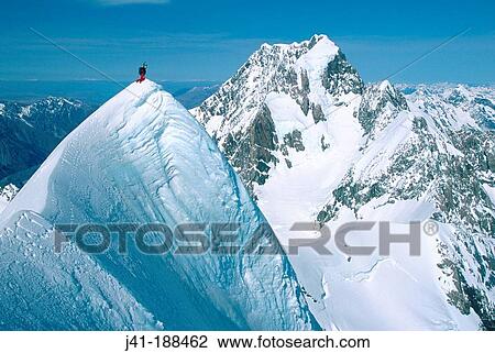Climber on summit of Mt. Tasman. Mt. Cook behind. Fox Glacier. Westland National Park. New Zealand View Large Photo Image Stock Image - Climber on summit of Mt. Tasman. Mt. Cook behind. Fox Glacier. Westland National Park. New Zealand. Fotosearch