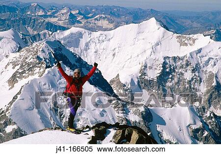 Climber on the summit of Mount Khuiten (4. 395 m. ). Altai Mountains. Mongolia View Large Photo Image Stock Photography - Climber on the summit of Mount Khuiten (4. 395 m. ). Altai Mountains. Mongolia. Fotosearch