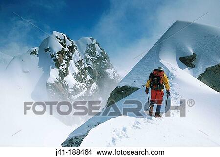 Climber on unnamed peak in winter mist. Fox Glacier. Westland National Park. Southern Alps. New Zealand View Large Photo Image Picture - Climber on unnamed peak in winter mist. Fox Glacier. Westland National Park. Southern Alps. New Zealand. Fotosearch