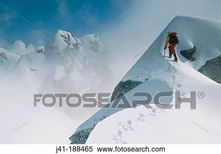 Climber on unnamed peak in winter mist. Fox Glacier. Westland National Park. Southern Alps. New Zealand View Large Photo Image Stock Photography - Climber on unnamed peak in winter mist. Fox Glacier. Westland National Park. Southern Alps. New Zealand. Fotosearch