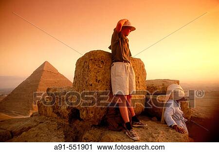 Stock Image - Climbing on a pyramid, Gizeh. Egypt. Fotosearch